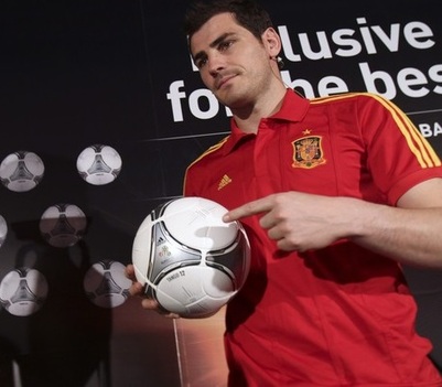 Spain's national team captain Casillas shows a model of the official ball for the Euro 2012 soccer match final in Madrid